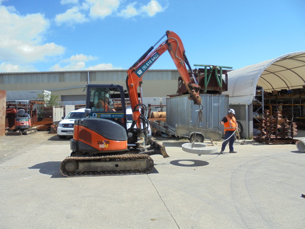 Sling, lift and place a load with mobile plant on an infrastructure